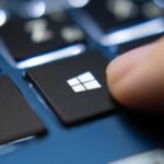 3253724-0-95648500-1792074620-Finger-pressing-Windows-key-on-a-blue-laptop-keyboard.jpg