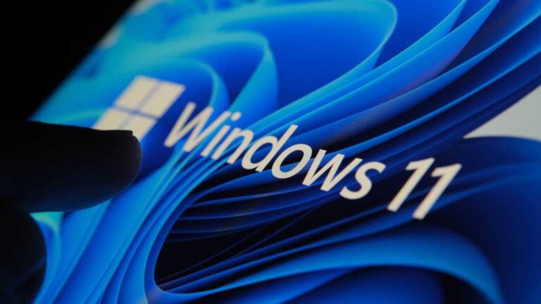 3267144-0-76962700-1792678587-Finger-touching-Windows-11-logo-on-screen-in-dark-room.jpg